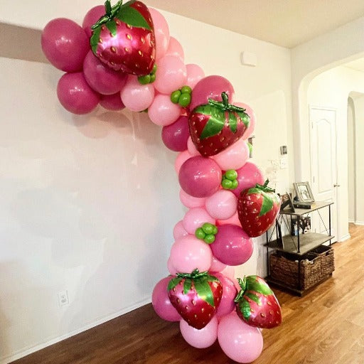 Austin What's Poppin pink balloon arch with strawberry balloons